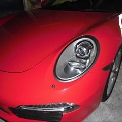 ポルシェの911（ABA-991MA104）：傷の修理方法と費用　左クォータープロラクターシール交換　部品代金8,695円/左ロッカーパネル板金塗装、ジャッキポイント修理　作業工賃190,000円/合計金額（税込）214,591円