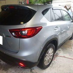 マツダのCX-5（LDA-KE2AW）：傷の修理方法と費用　リアバンパー修理費用　作業工賃25,000円／右リアアーチモール交換　部品代金4,900円／合計金額（税込）32,292円