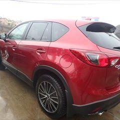 マツダのCX-5（LDA-KE2AW）：傷の修理方法と費用　アーチモール、どろよけの交換　部品代金9,800円／左リアバンパー修理費用　作業工賃30,000円／合計金額（税込）42,984円　